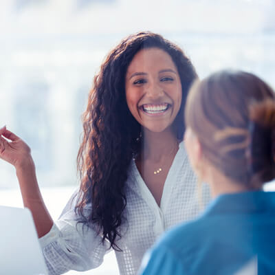 Smiling person walking into the office